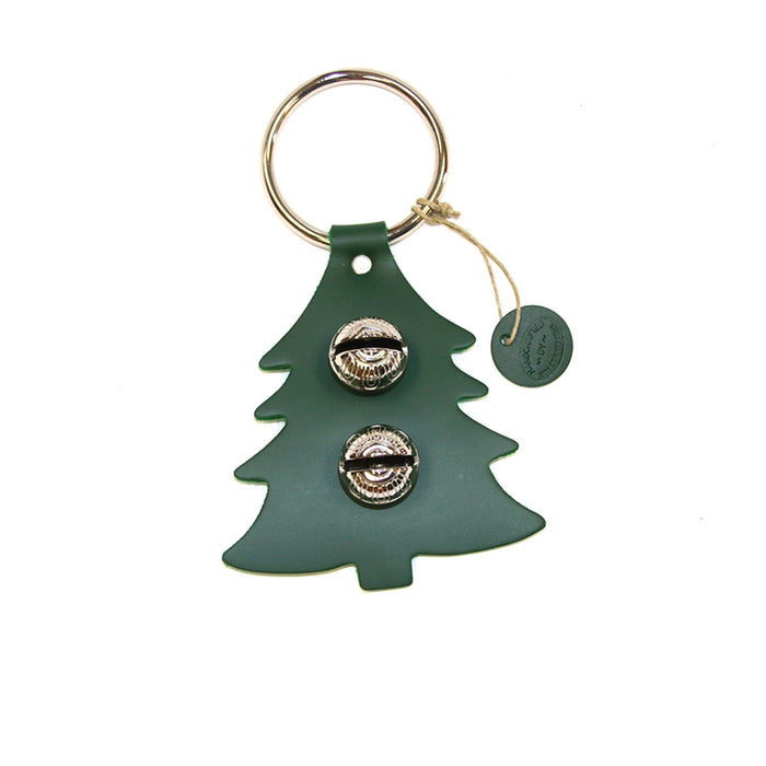 Green tree-shaped keychain with two metallic charms on a white background