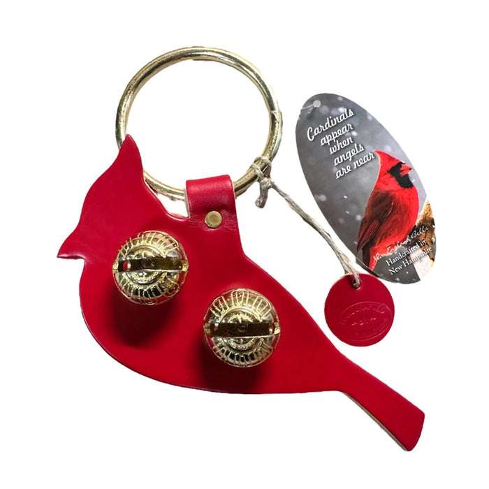 Red cardinal-shaped keychain with gold accents on a white background