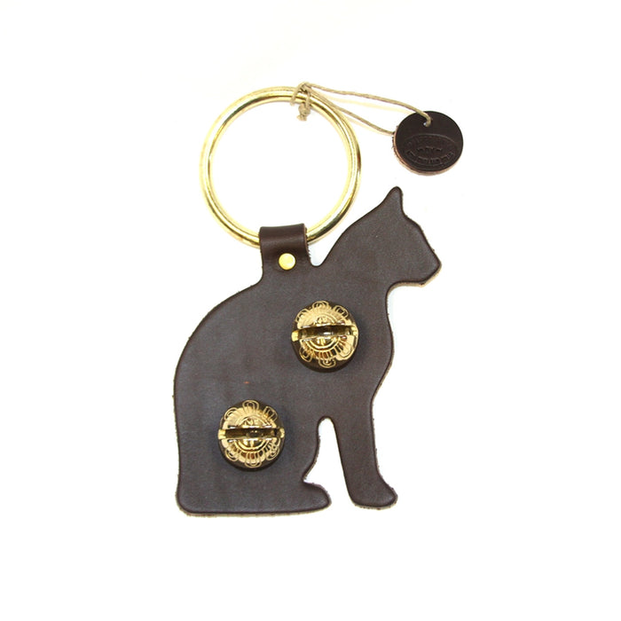 Cat-shaped keychain with gold accents on a white background