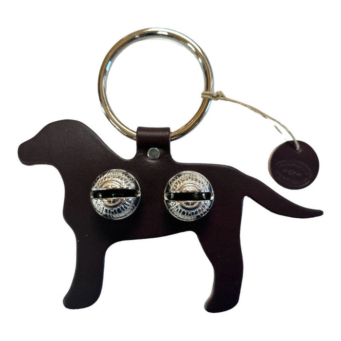 Dog-shaped keychain with metallic eyes on a white background