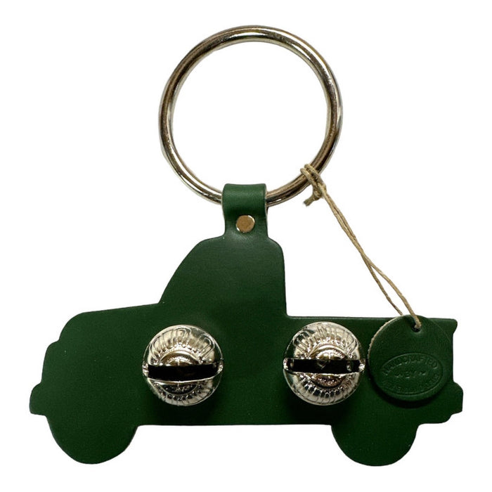 Green keychain with silver buttons on a white background