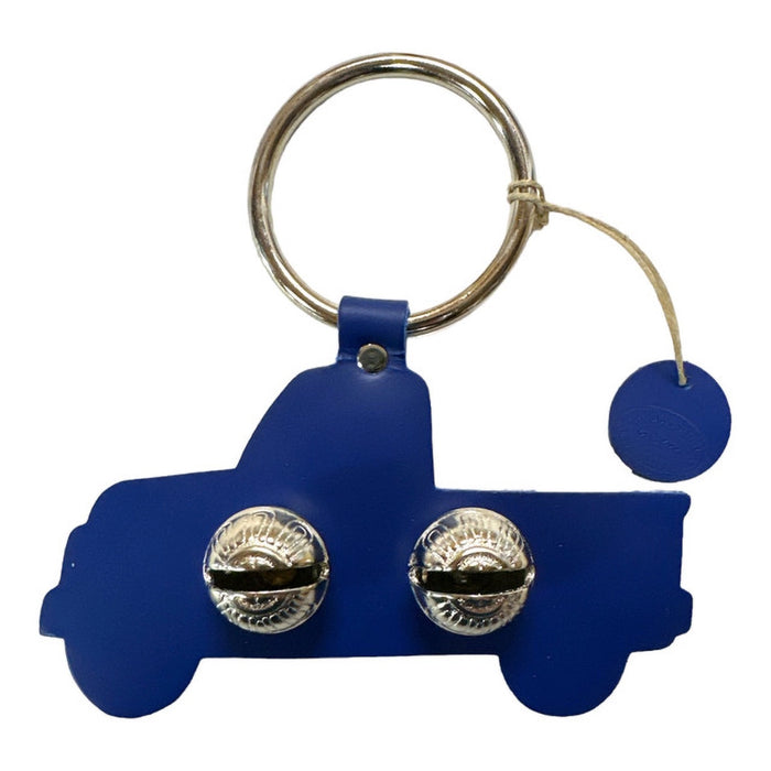 Blue truck-shaped keychain with silver bells on a white background