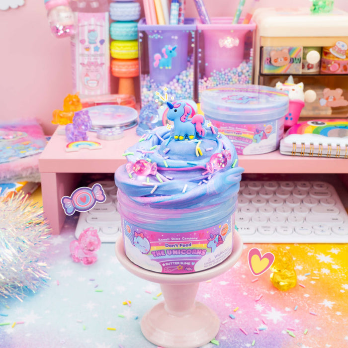 Colorful unicorn-themed product on a stand with a pastel-colored desk in the background