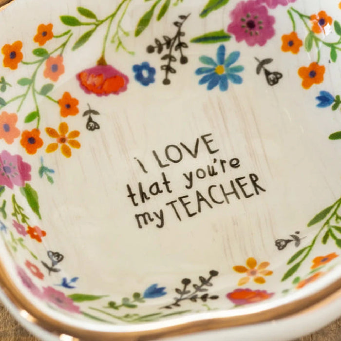 A decorative ceramic dish featuring the words "I love my teacher," symbolizing gratitude for teaching.