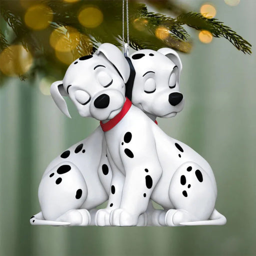 Disney 101 Dalmatians Christmas tree ornament hanging on pine branch with festive lights
