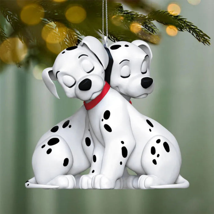 Disney 101 Dalmatians Christmas tree ornament hanging on pine branch with festive lights