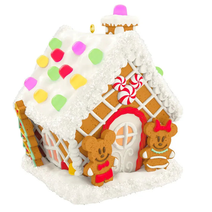 Mickey and Minnie Mouse cookie figures at entrance of gingerbread house ornament