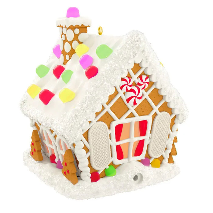 Side view of gingerbread house ornament showing icing lattice windows and shutters