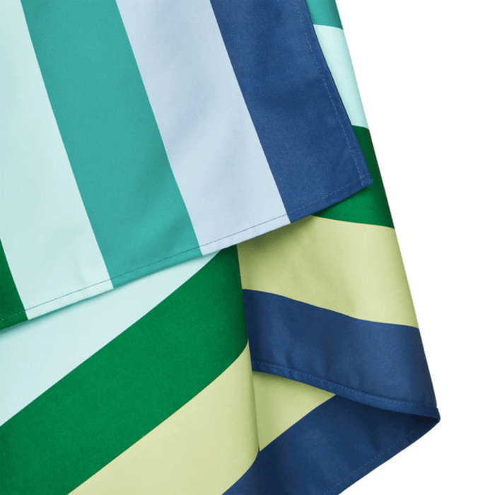 Close-up of Dock & Bay Color Canyon quick dry towel showing soft recycled microfiber and bold green, blue, and yellow stripes