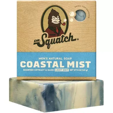 Dr. Squatch Coastal Mist Bar Soap packaging and bar — men’s natural soap with seaweed extract, sand, and light exfoliation in blue-and-cream swirled design.