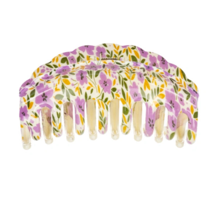 Ganz floral hair claw clips in a storage canister featuring stylish flower designs for everyday hair styling and accessories.