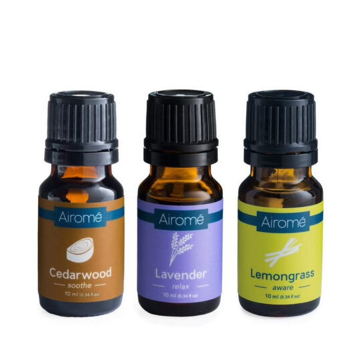 Three Airomé essential oil bottles labeled Cedarwood, Lavender, and Lemongrass on a white background.