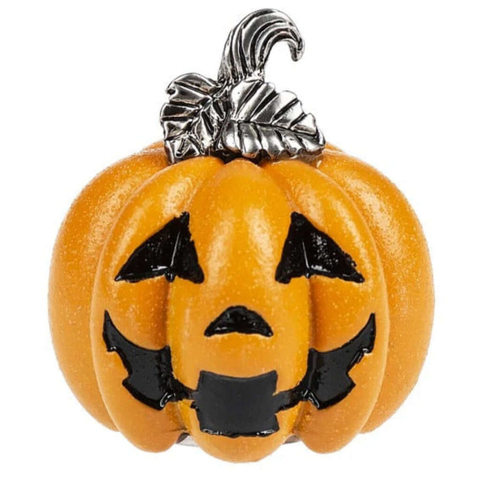 Pumpkin-shaped brooch with a silver top on a white background
