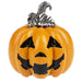 Pumpkin-shaped brooch with a silver top on a white background