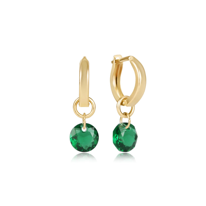 "The sleek hoop design pairs beautifully with the vibrant gemstone-inspired drops, creating a timeless accessory that effortlessly transitions from day to evening wear"