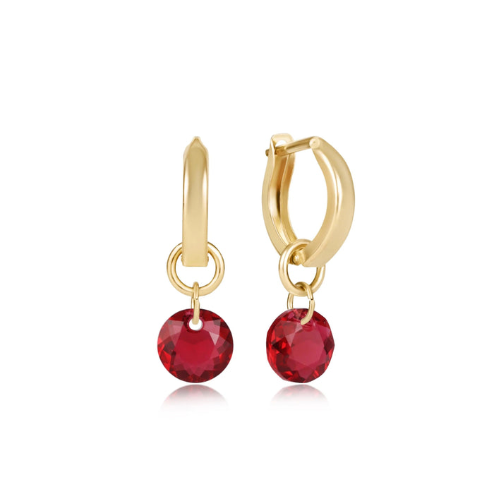 "Lightweight and comfortable, these earrings bring a sophisticated pop of color to any outfit.&nbsp;Polished gold-tone hoop earrings.&nbsp;Sparkling faceted red crystal drop charms"