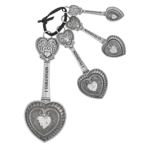 Silver key-shaped keychain with heart designs on a white background