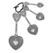 Silver key-shaped keychain with heart designs on a white background
