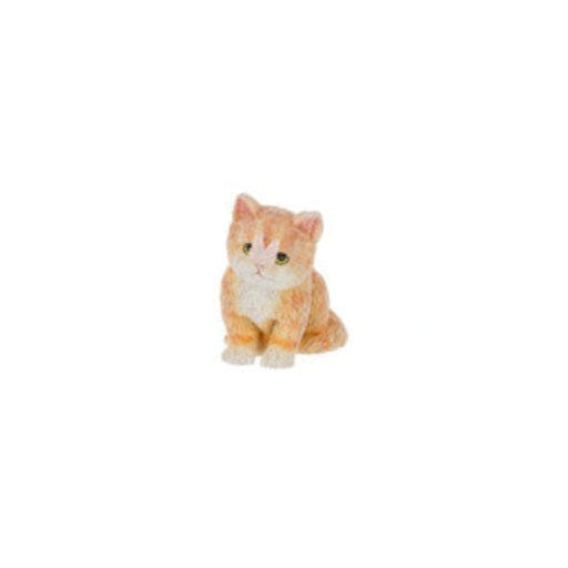 Three small ginger cat figurines sitting side by side on a plain white background.