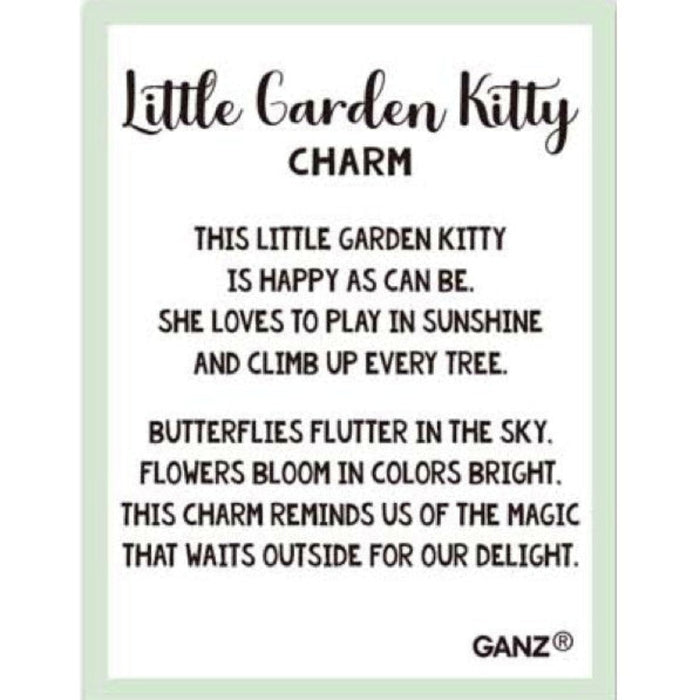 A square charm or plaque with rounded corners featuring the text 'Little Garden Kitty CHARM' and a poem about a happy garden kitty, with 'GANZ' at the bottom right. The design has a white center, black text, and a pale mint green border on a light gray background.