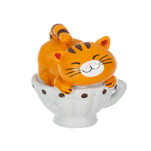 Orange tiger figurine sitting on a white ceramic base with brown spots on a white background