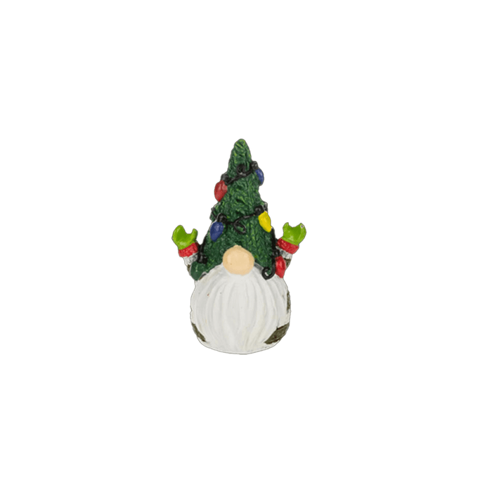 Decorative gnome with a Christmas tree on its head against a white background