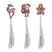 Three Christmas-themed spoons with decorative ends on a white background