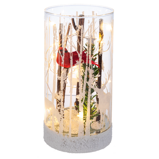 Decorative glass vase with branches and a red ribbon on a white background