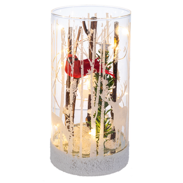 Decorative glass vase with branches and a red ribbon on a white background