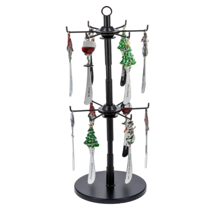 Black jewelry display stand with various small ornaments on a white background
