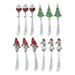 Set of Christmas-themed spoons with decorative ends on a white background