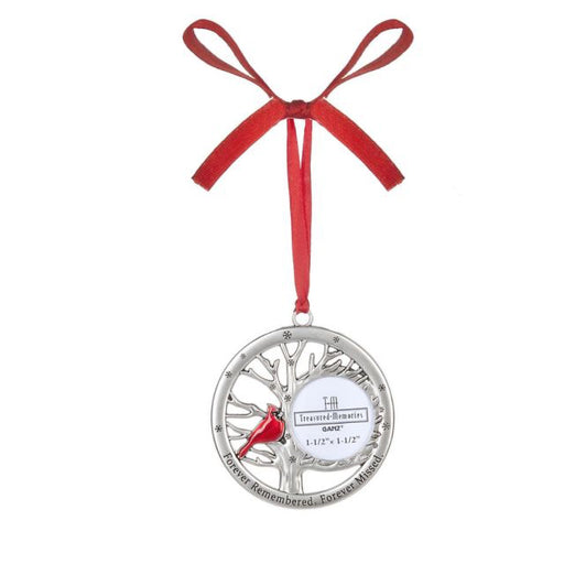 Silver tree ornament with red ribbon on a white background