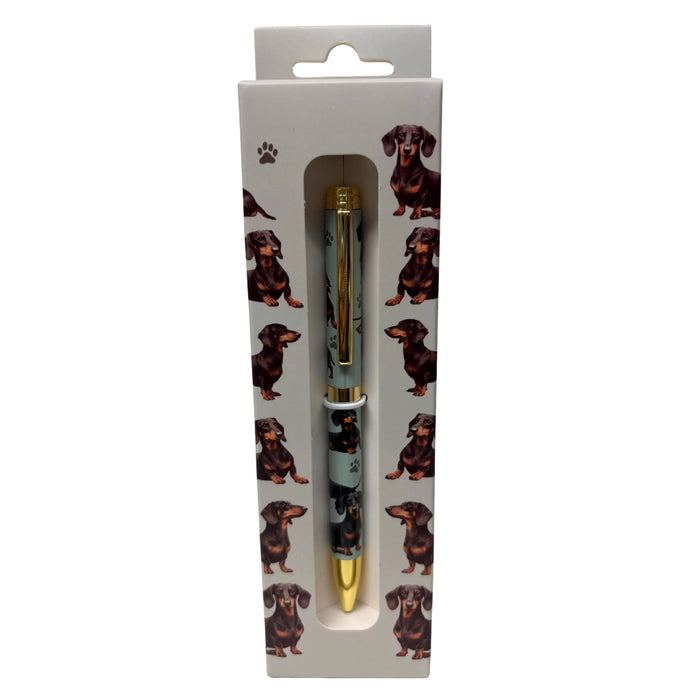 Black Dachshund-themed gift boxed ballpoint pen with gold accents and dog illustrations.