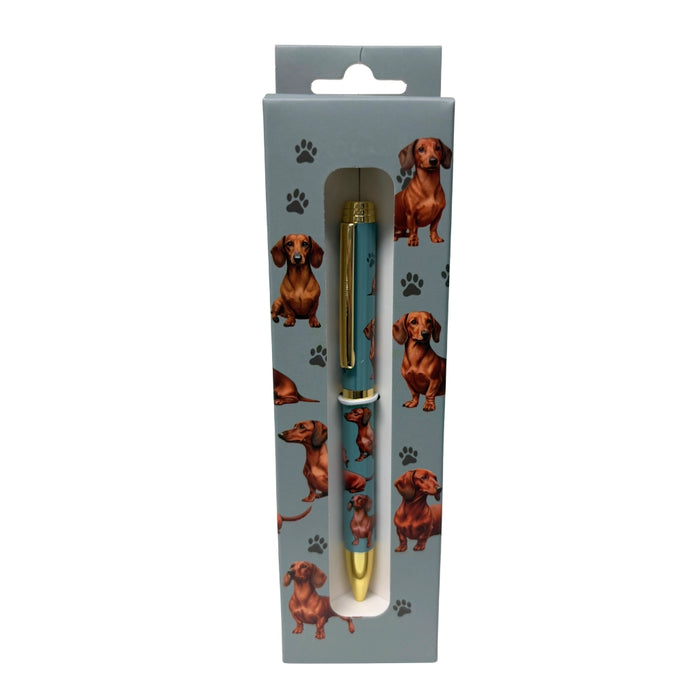 Red Dachshund-themed gift boxed ballpoint pen with gold accents and dog illustrations.
