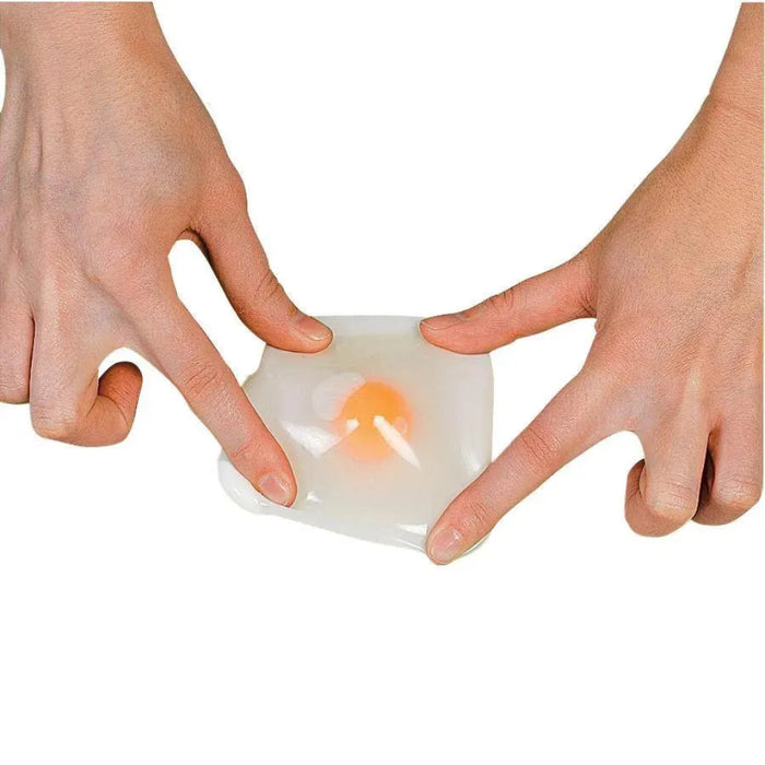 Two hands holding a small white container with a lit candle inside on a white background