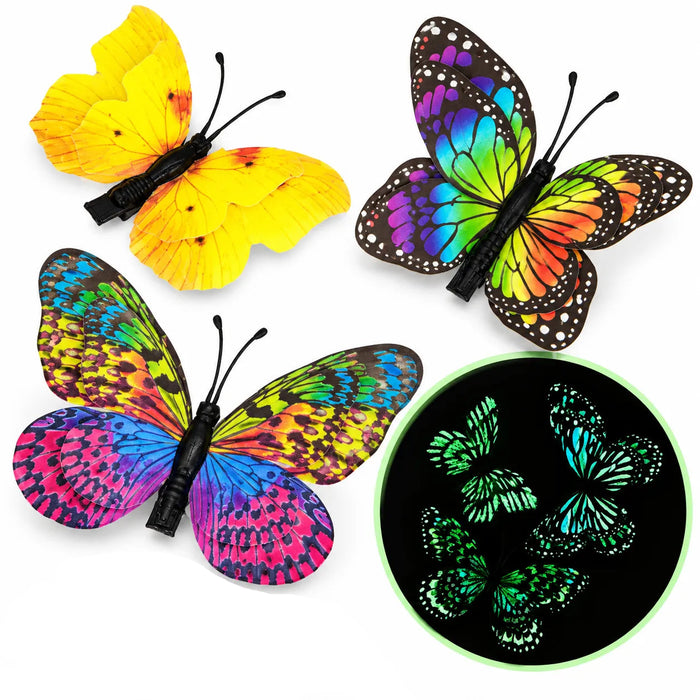 Three colorful butterfly-shaped hair clips are shown on a white background, with one clip open and two closed. A circular inset shows the butterflies glowing green in the dark.