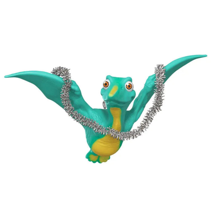 Toy dragon with a silver necklace on a white background