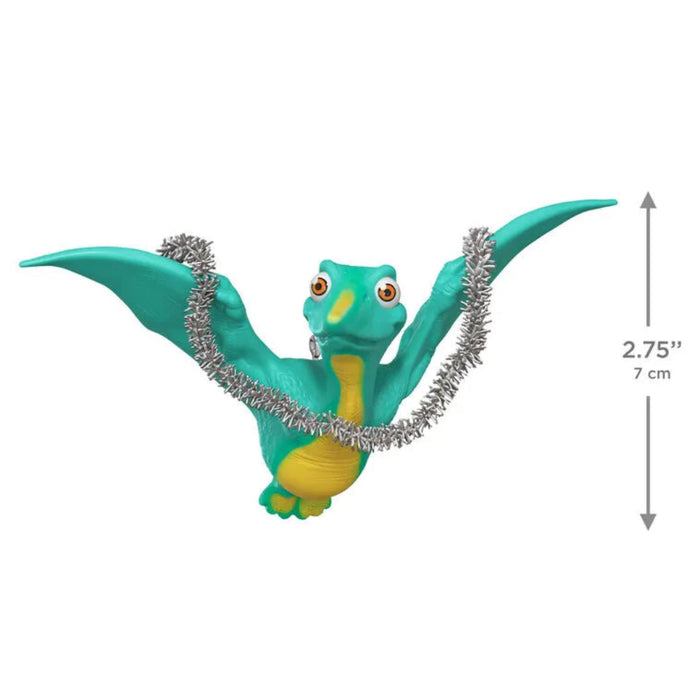 Toy dragon with a measurement label on a white background