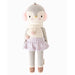 Front view of Cuddle + Kind Skylar the Penguin doll wearing soft pink earmuffs, a cream knit scarf with pom-poms, lavender skirt, gray leggings, and brown knit shoes.