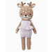A knitted deer doll wearing a soft lavender romper with a ruffled waist, smiling with white embroidered spots on its head.