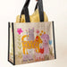 A hand grips a bright bag showcasing various cats and dogs in a playful pattern.