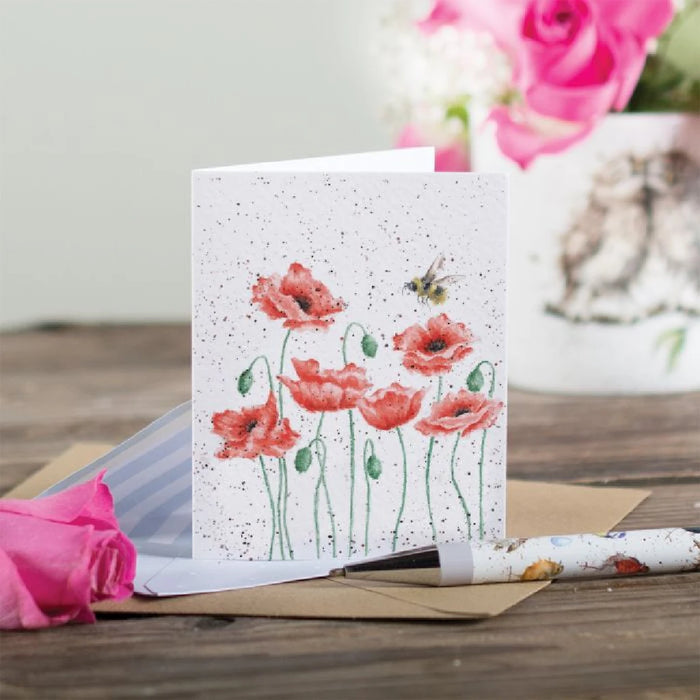 A decorative greeting card adorned with red poppies and bees, representing a lively spring theme.