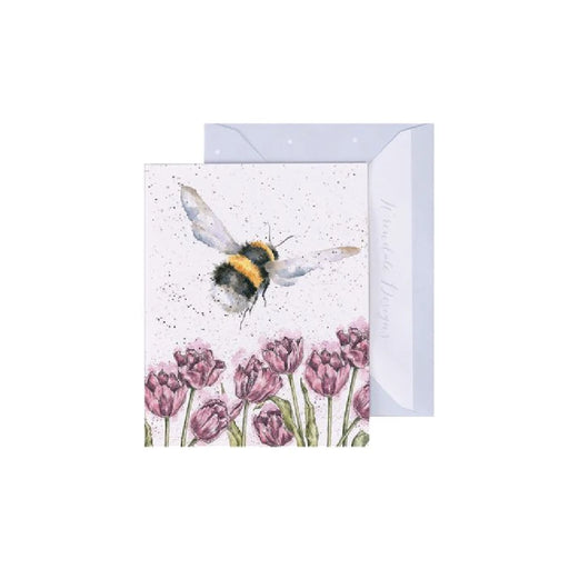 A greeting card featuring a bee hovering over vibrant tulips in a sunny garden setting.