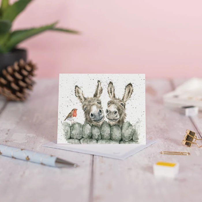 A playful donkey depicted on a greeting card, conveying a friendly message for various celebrations and greetings.
