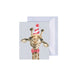 A giraffe adorned with a colorful birthday hat and a stylish bow tie, celebrating a festive occasion.