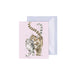 A greeting card featuring two playful cats sitting together against a colorful background.
