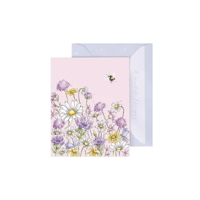 Floral card featuring a daisy with a bee resting on its petals against a soft background.