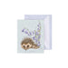  A decorative card showcasing a daisy flower with a bee perched on it, set against a gentle backdrop.