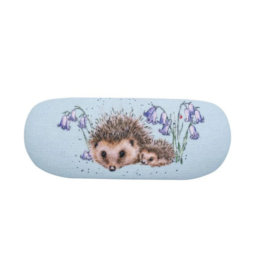 A hedgehog nestled among bluebells on a vibrant blue background, showcasing a serene natural scene.