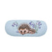 A hedgehog nestled among bluebells on a vibrant blue background, showcasing a serene natural scene.